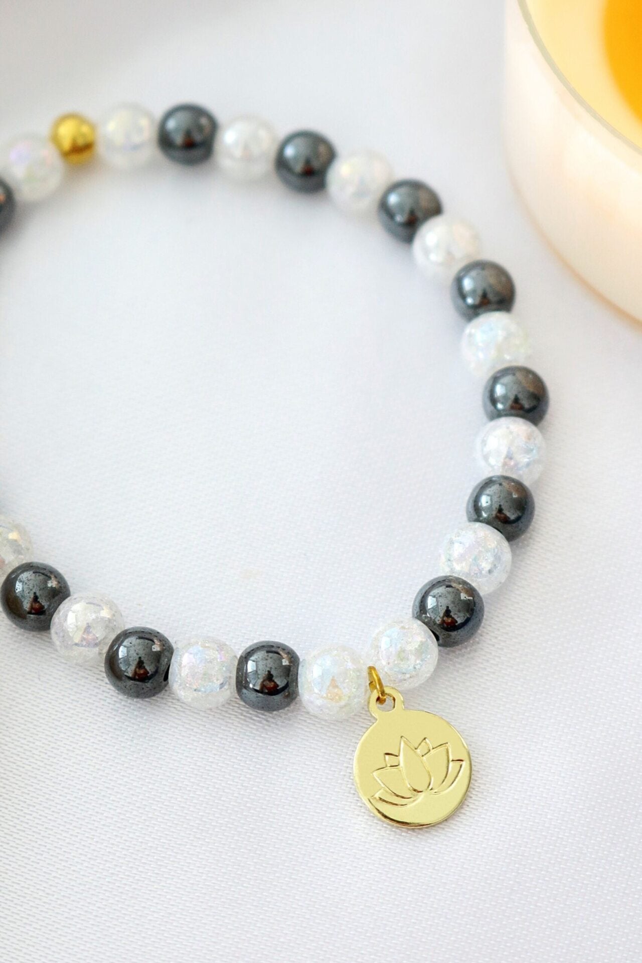 Hematite Elastic Bracelet | 24K Lotus Flower Charm